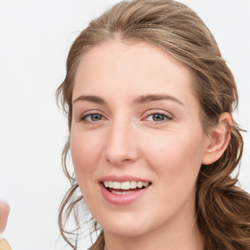 Joyful white young-adult female with medium  brown hair and blue eyes