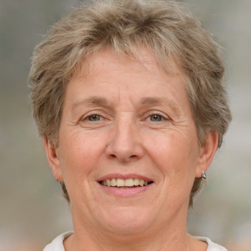 Joyful white middle-aged female with short  brown hair and brown eyes