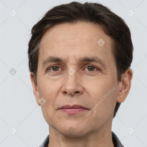 Joyful white adult male with short  brown hair and brown eyes