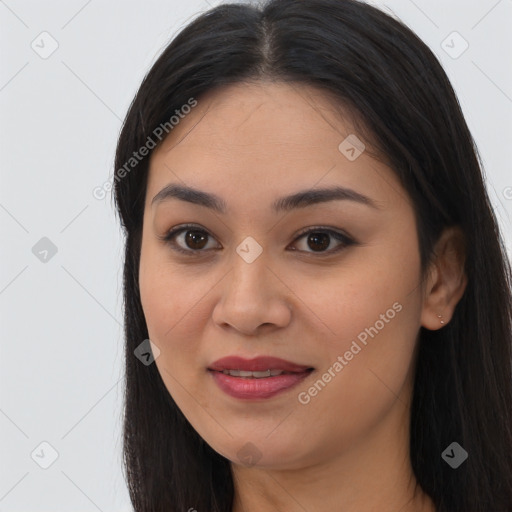 Joyful asian young-adult female with long  brown hair and brown eyes