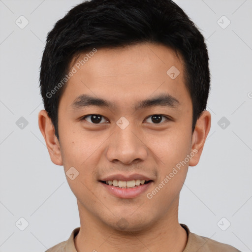 Joyful asian young-adult male with short  brown hair and brown eyes