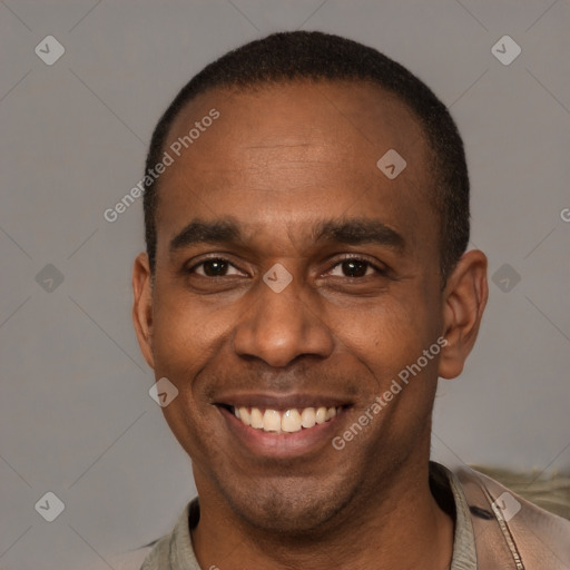 Joyful latino adult male with short  brown hair and brown eyes
