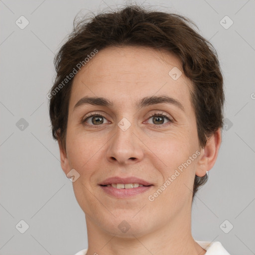 Joyful white adult female with short  brown hair and brown eyes