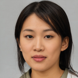 Neutral asian young-adult female with medium  brown hair and brown eyes