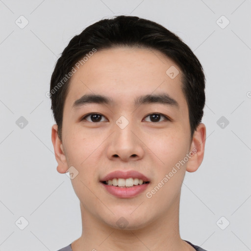 Joyful asian young-adult male with short  black hair and brown eyes