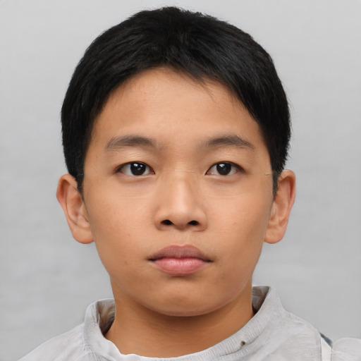 Neutral asian child male with short  brown hair and brown eyes