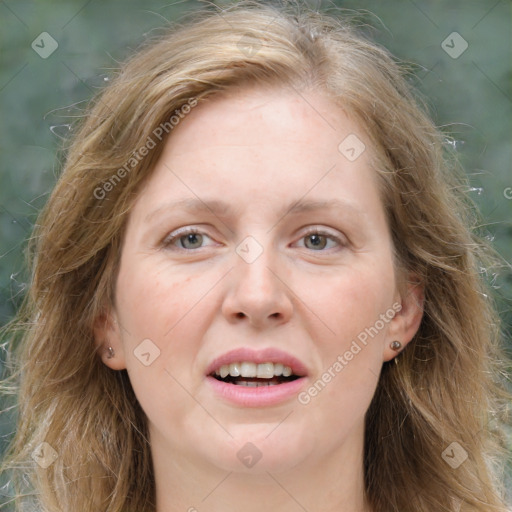 Joyful white adult female with long  brown hair and grey eyes