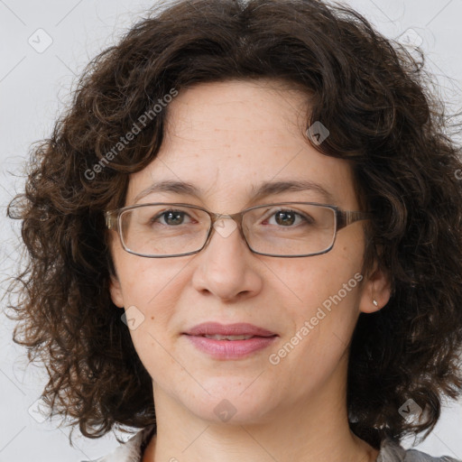 Joyful white adult female with medium  brown hair and brown eyes