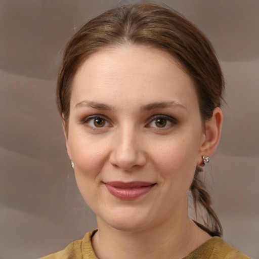 Joyful white young-adult female with medium  brown hair and brown eyes