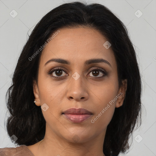 Joyful latino young-adult female with medium  brown hair and brown eyes