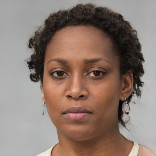 Neutral black young-adult female with short  brown hair and brown eyes