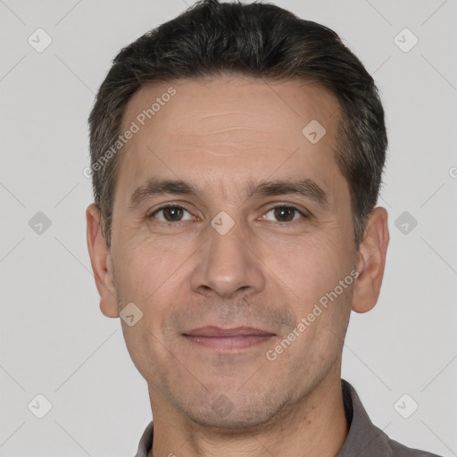 Joyful white adult male with short  brown hair and brown eyes