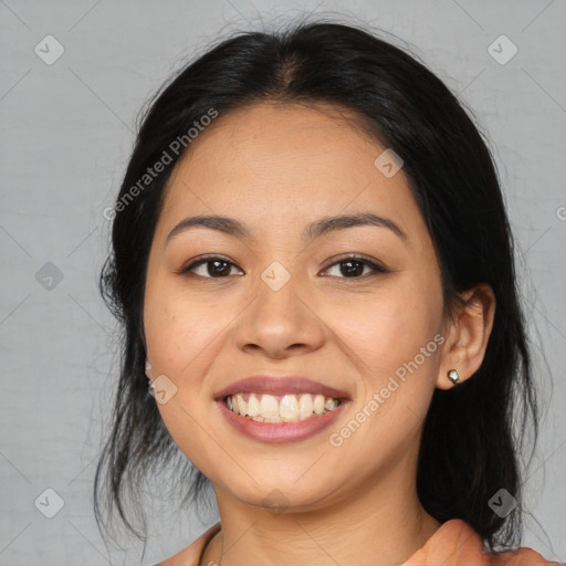 Joyful asian young-adult female with medium  black hair and brown eyes