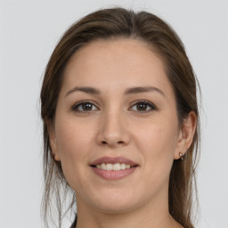 Joyful white young-adult female with long  brown hair and grey eyes