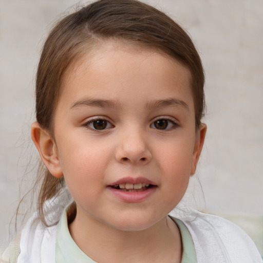 Joyful white child female with short  brown hair and brown eyes