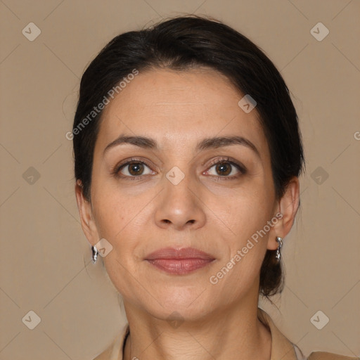 Joyful white adult female with medium  brown hair and brown eyes