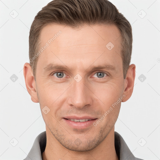 Joyful white adult male with short  brown hair and brown eyes