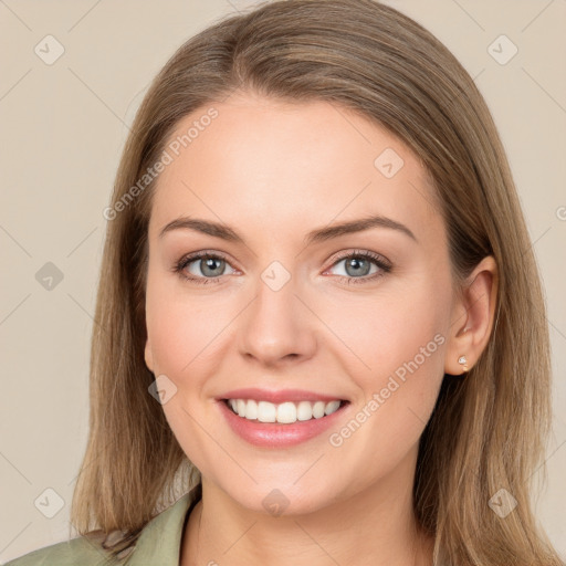 Joyful white young-adult female with long  brown hair and green eyes