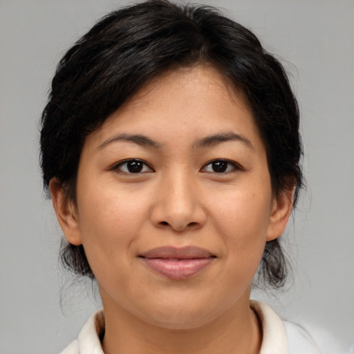 Joyful asian young-adult female with medium  brown hair and brown eyes
