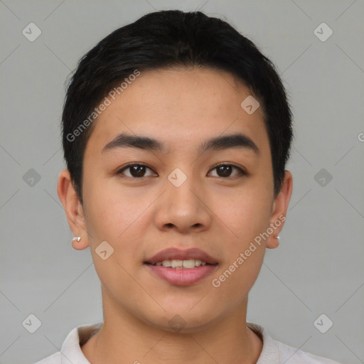 Joyful asian young-adult male with short  brown hair and brown eyes