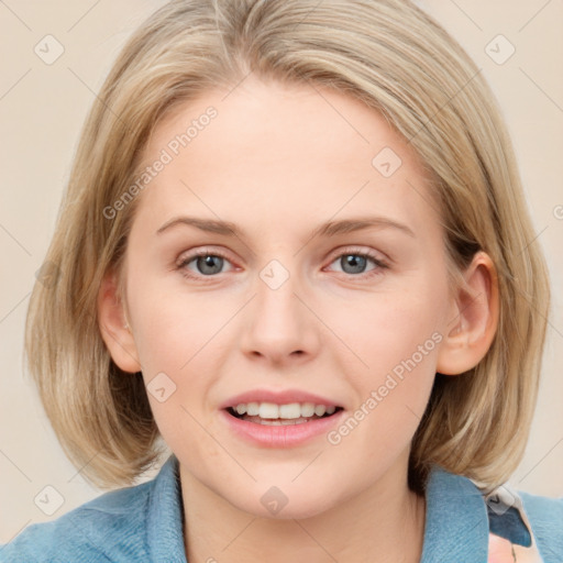 Joyful white young-adult female with medium  brown hair and blue eyes