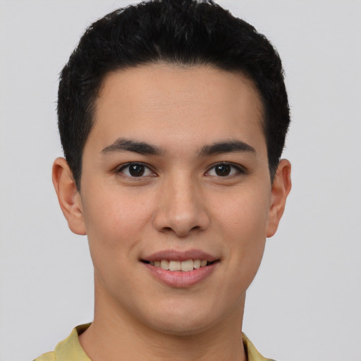 Joyful latino young-adult male with short  brown hair and brown eyes