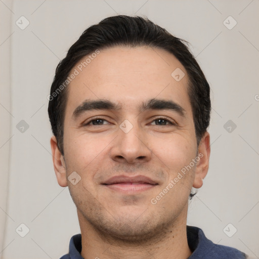 Joyful white young-adult male with short  black hair and brown eyes