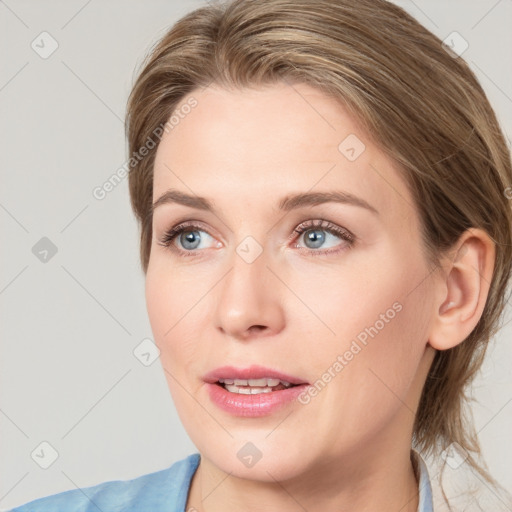 Joyful white young-adult female with medium  brown hair and blue eyes