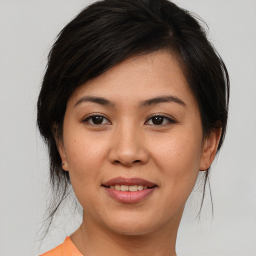 Joyful asian young-adult female with medium  brown hair and brown eyes