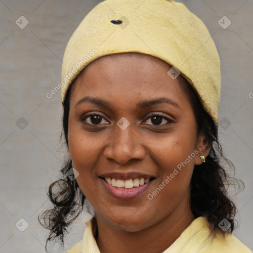 Joyful black young-adult female with medium  brown hair and brown eyes