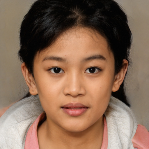 Joyful asian child female with medium  brown hair and brown eyes