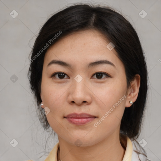 Joyful asian young-adult female with medium  brown hair and brown eyes