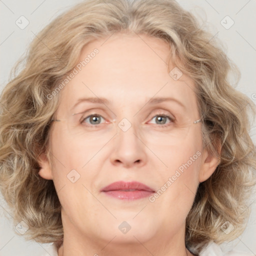 Joyful white adult female with medium  brown hair and blue eyes