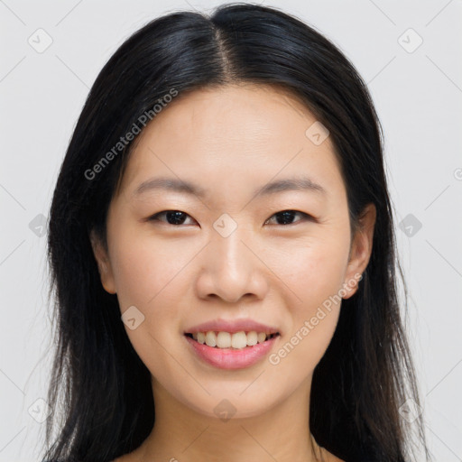 Joyful asian young-adult female with long  brown hair and brown eyes