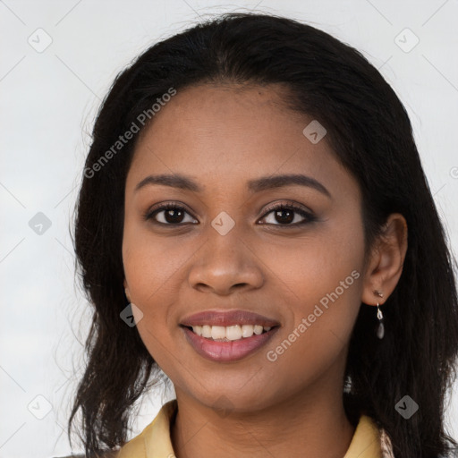 Joyful black young-adult female with long  brown hair and brown eyes