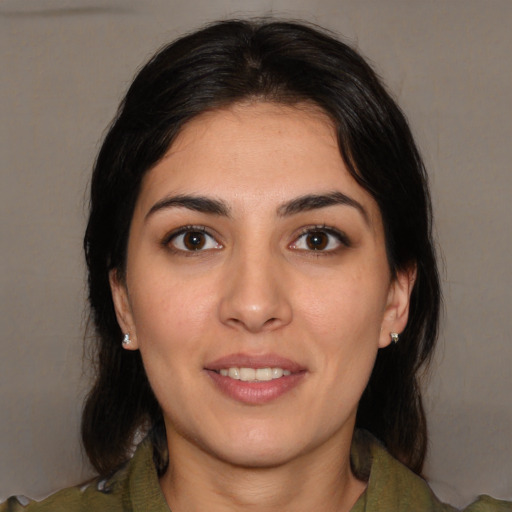 Joyful white young-adult female with medium  brown hair and brown eyes