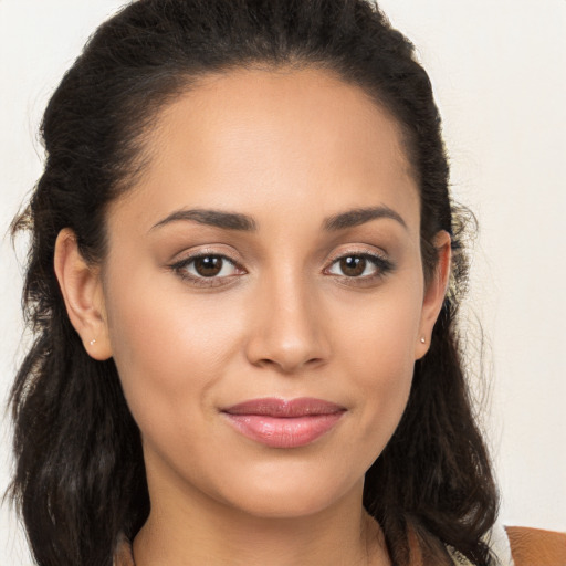 Joyful white young-adult female with long  brown hair and brown eyes