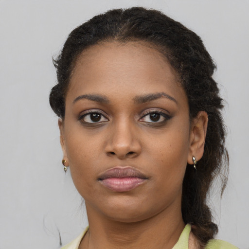 Neutral black young-adult female with long  brown hair and brown eyes