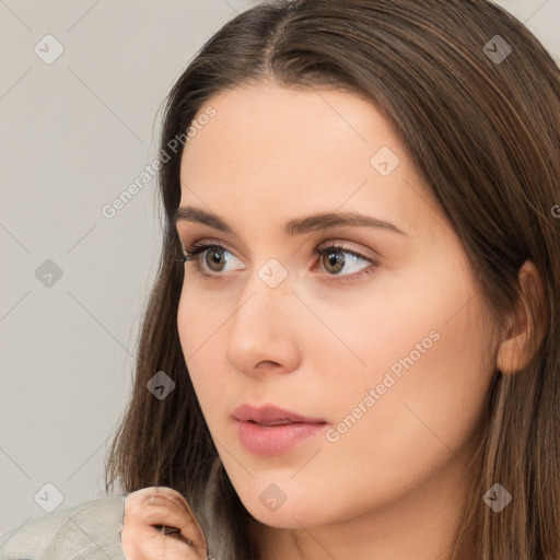 Neutral white young-adult female with long  brown hair and brown eyes