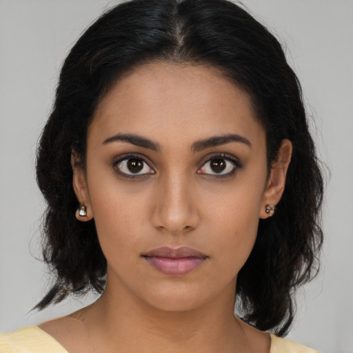 Neutral latino young-adult female with medium  brown hair and brown eyes
