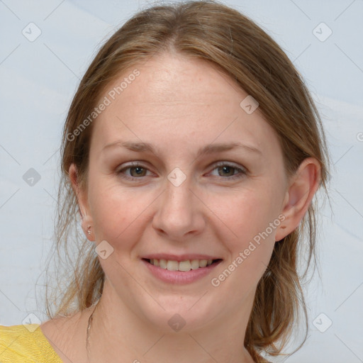 Joyful white young-adult female with medium  brown hair and blue eyes