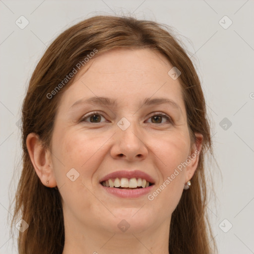 Joyful white young-adult female with long  brown hair and brown eyes