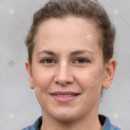 Joyful white adult female with short  brown hair and brown eyes