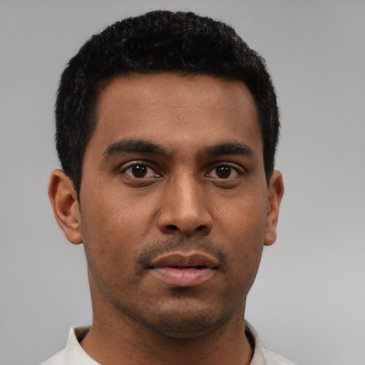 Neutral black young-adult male with short  black hair and brown eyes