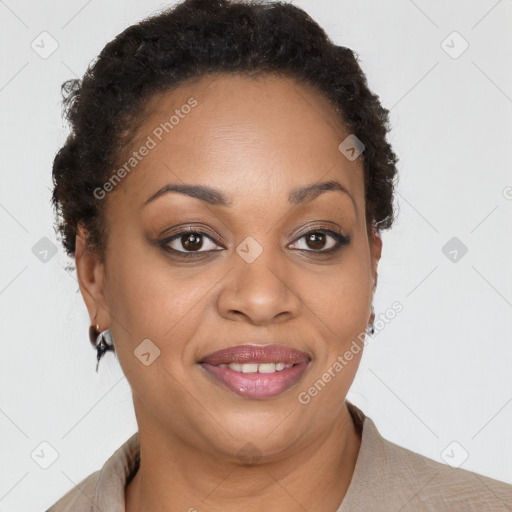 Joyful black adult female with short  brown hair and brown eyes