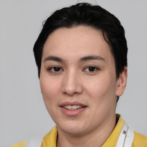 Joyful white young-adult female with short  black hair and brown eyes