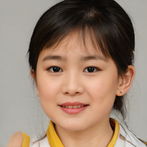 Joyful asian child female with medium  brown hair and brown eyes