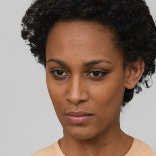 Neutral black young-adult female with short  black hair and brown eyes