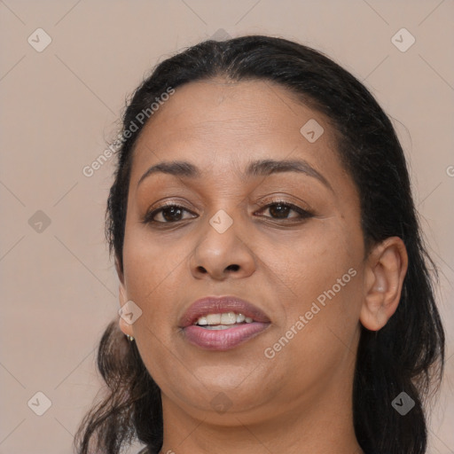 Joyful white adult female with long  brown hair and brown eyes