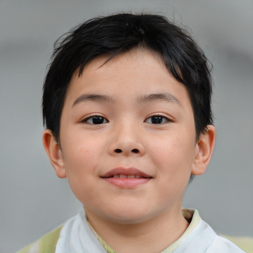 Joyful asian child male with short  brown hair and brown eyes
